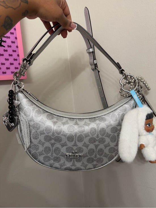 Coach Handbags - Coach Silver Signature Crescent Shoulder Bag with Plush Charm
